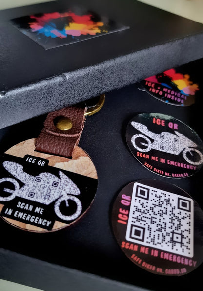 Set of round keychain with ICE QR codes and motorcycle designs in a black box.